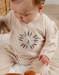 Beige velours pyjama met geborduurde leeuw
