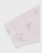 Ivoorkleurige babypyjama met zeehondenprint in fluweel
