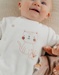Velours baby pyjama met kattenborduursel
