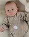 Beige baby pyjama with seal embroidery in velvet
