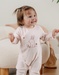 Pink velour baby pyjamas with bunny embroidery
