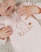 Pink velour baby pyjamas with bunny embroidery
