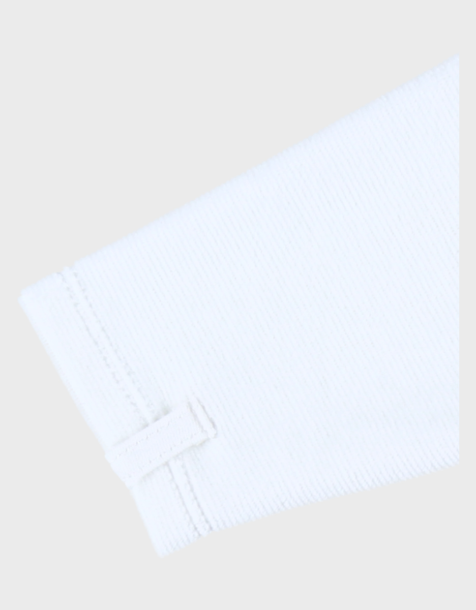 White corduroy baby pyjamas with bunny embroidery
