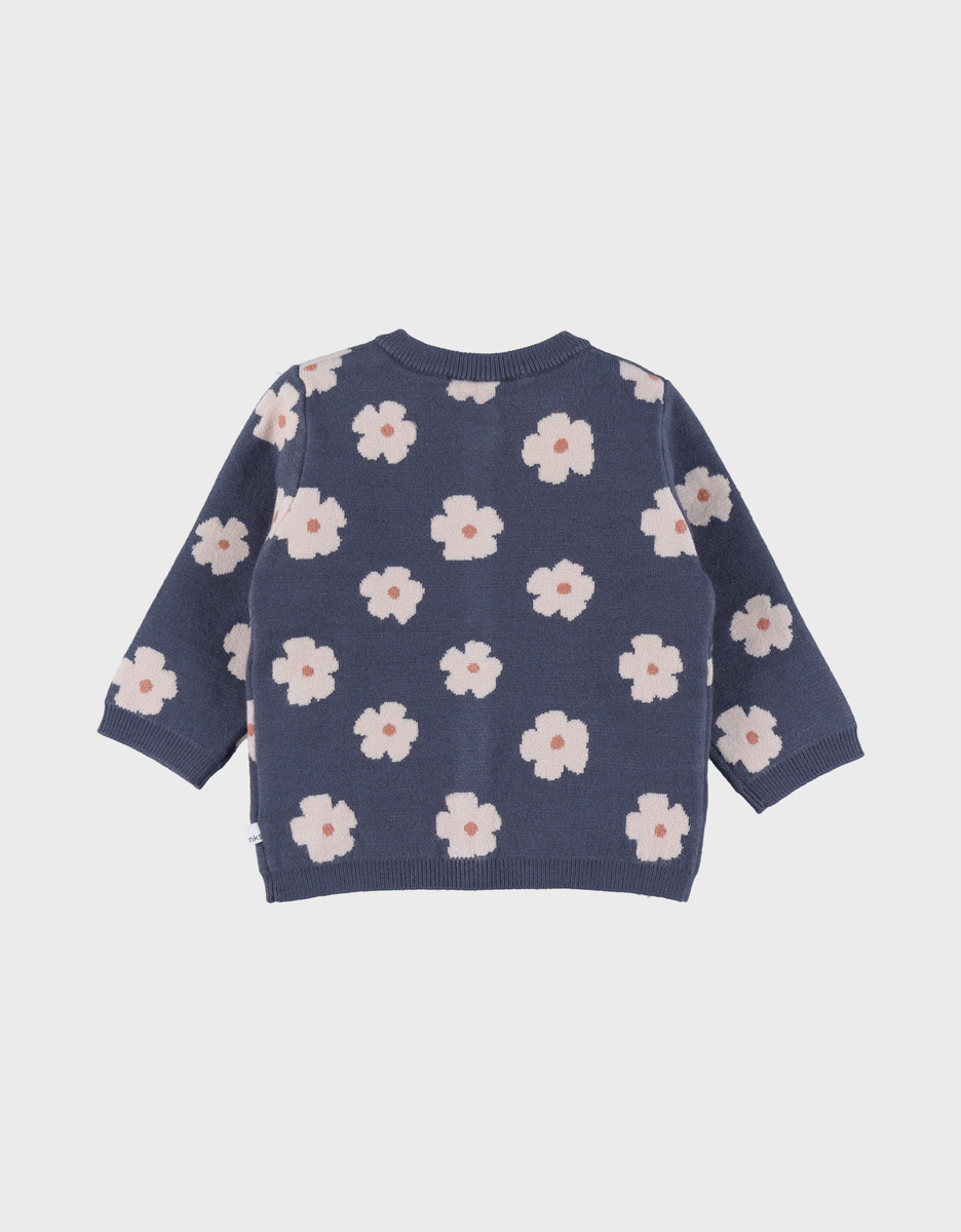 Gebreid vest met blauwe bloemen

