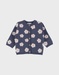 Gebreid vest met blauwe bloemen
