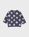 Gebreid vest met blauwe bloemen
