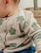 Light beige knit cardigan with floral pattern
