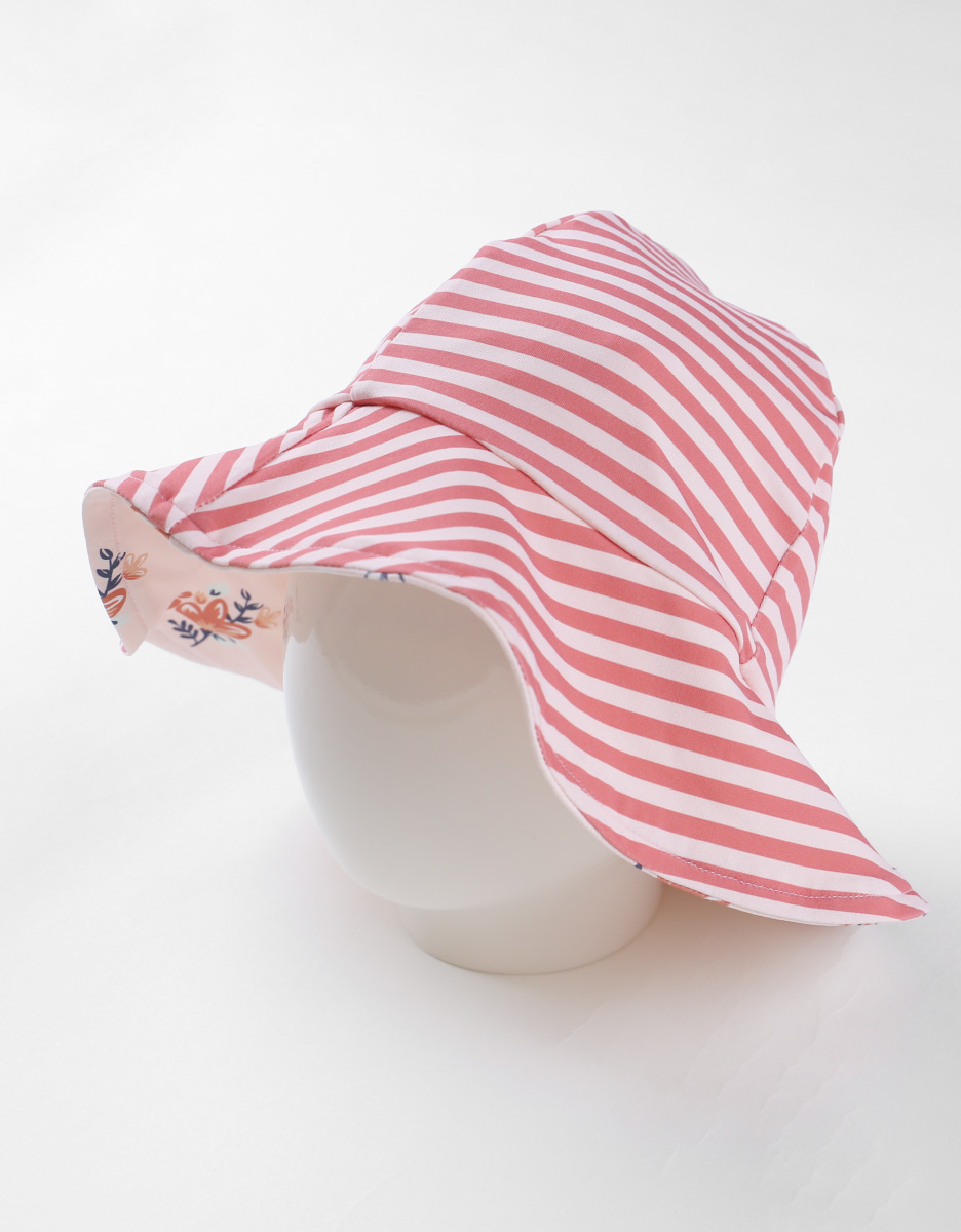 Reversible hat with floral prints, light pink/terracotta