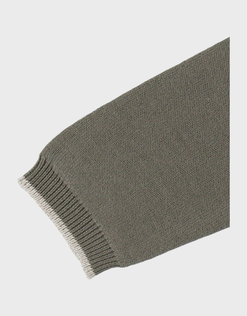 Combinaison en tricot vert avec motif zèbre