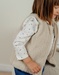 Lattekleurige bodywarmer in Groloudoux®
