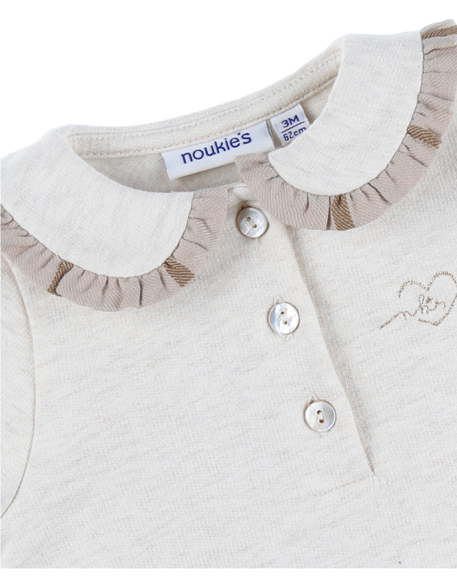 Tweekleurige babyjurk met beige ruitjes
