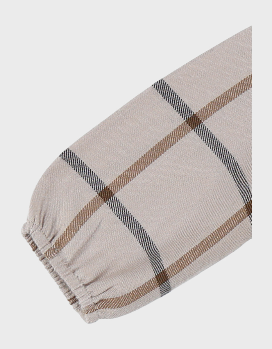 Babyjurk met beige ruitjes
