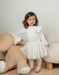 Witte jurk in twee materialen met gebreid lurex

