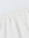 Witte jurk in twee materialen met gebreid lurex

