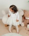 Witte jurk in twee materialen met gebreid lurex
