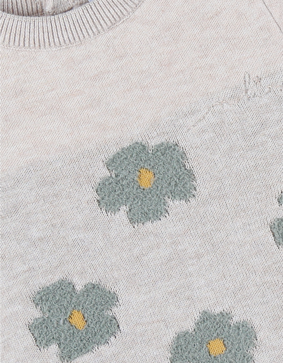 Light beige knit dress with floral pattern
