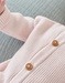 Combinaison en tricot, rose clair