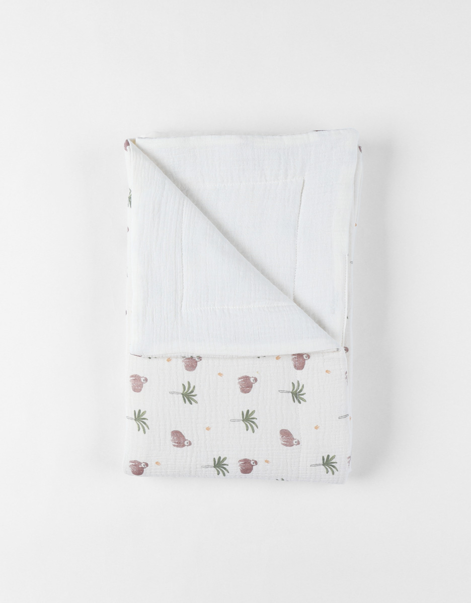 Cotton muslin blanket with a gorilla patern, off-white