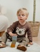 Pull en tricot marron avec motif ours