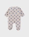 Baby pyjama van beige velours met hartjesprint
