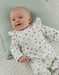 Witte velours baby pyjama met vogelprint
