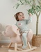 Baby pyjama van groene velours met slakkenborduursel
