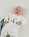 Baby pyjamas in white velour with bird embroidery
