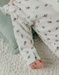 White velour baby pyjamas with bird print
