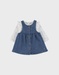 Set denim salopette blauw en wit T-shirt
