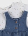 Set denim salopette blauw en wit T-shirt
