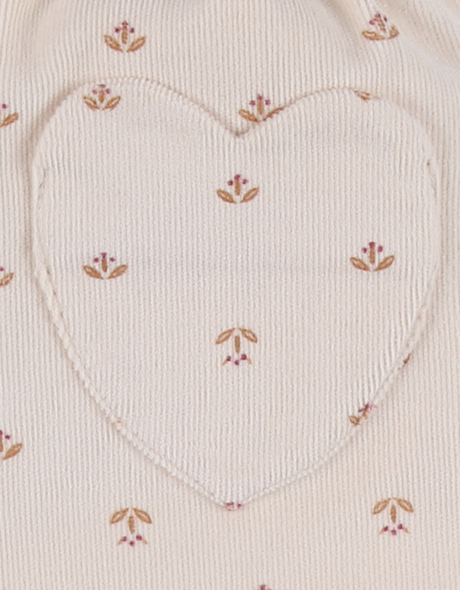 Corduroy trousers with floral print in blush pink
